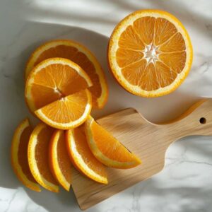 orange cut into 8 wedges on a white countertop.